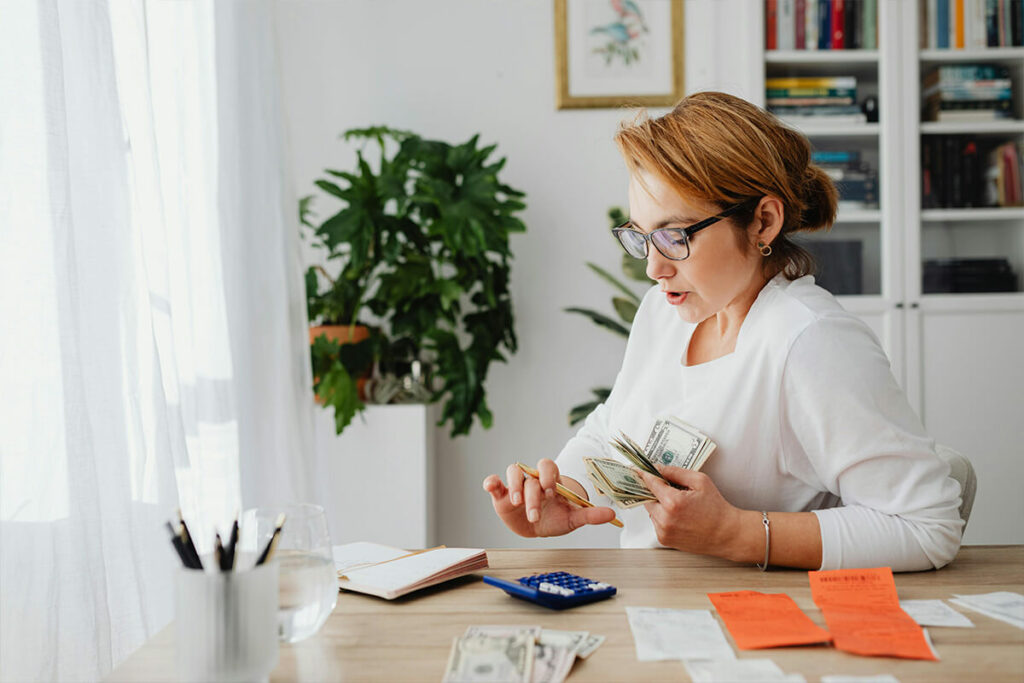 A woman calculating money