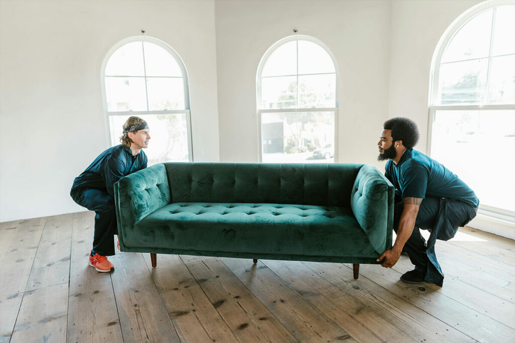 Movers carrying a sofa